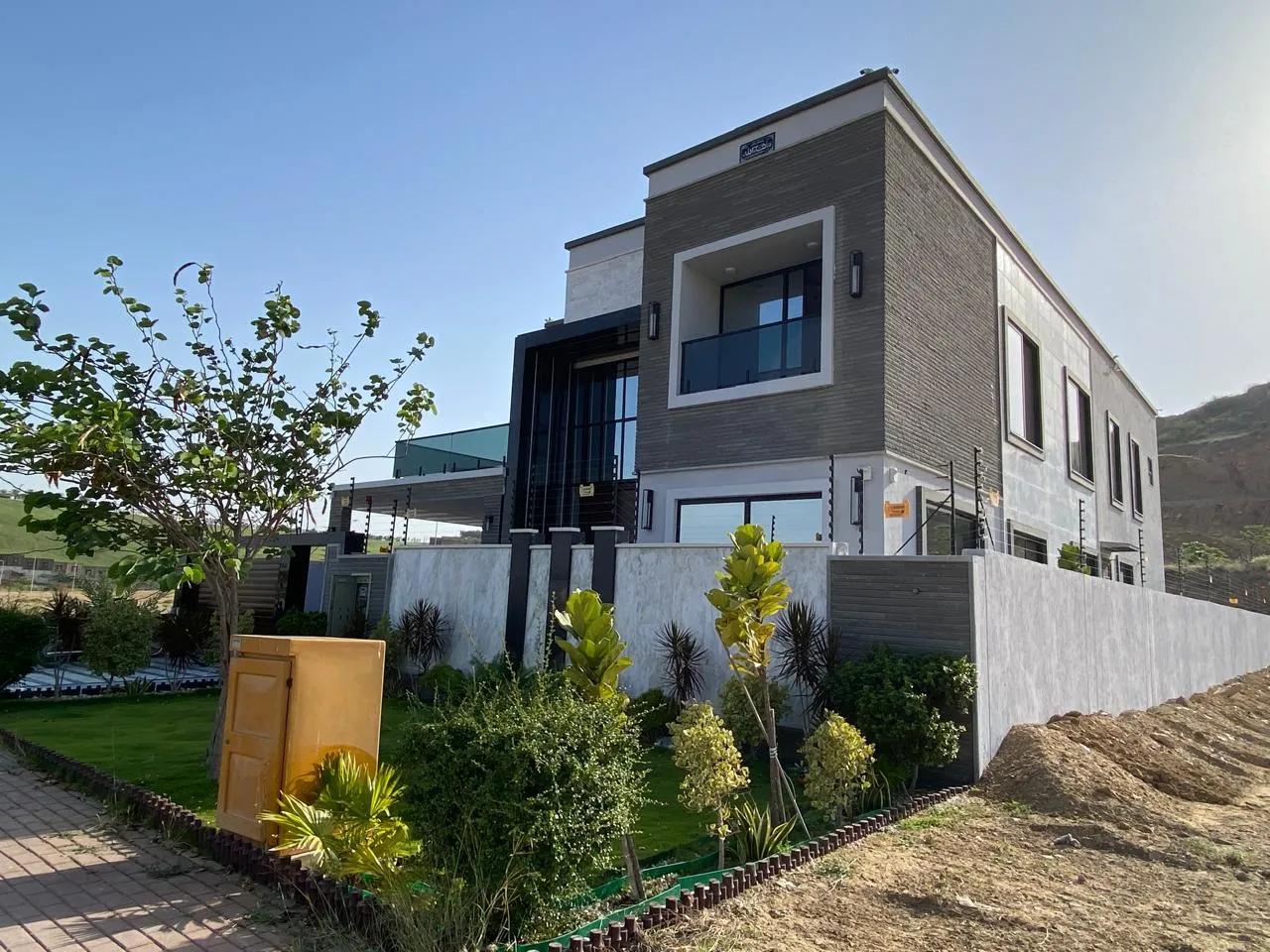 Residential construction project with landscaped exterior in Karachi